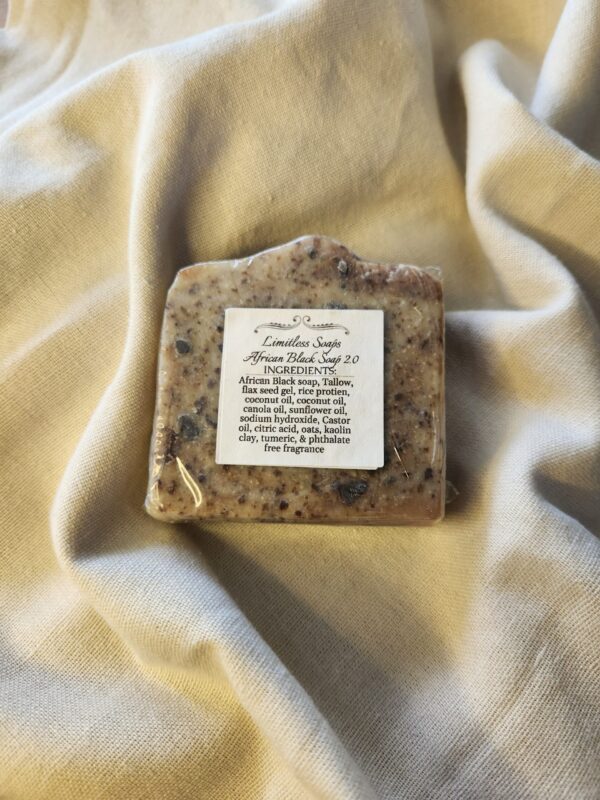 African1 soap bar with flecks of black and deep red with product label