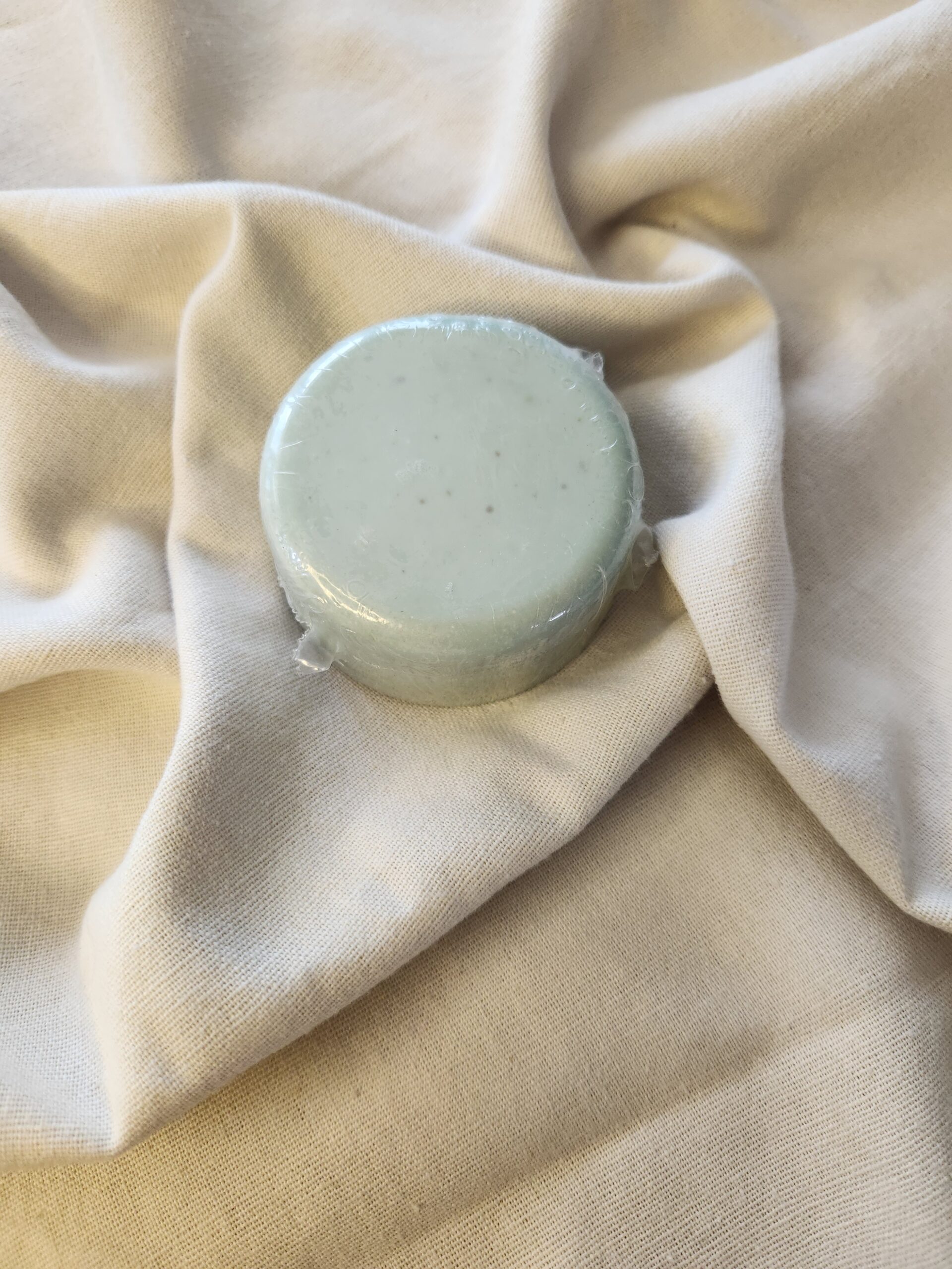 pale green-blue shampoo bar
