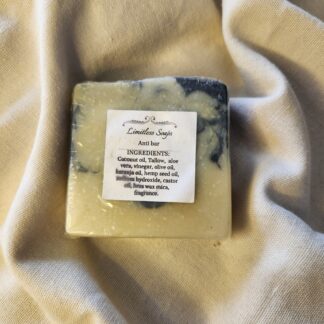 soap bar with swirls of black and pale yellow with product label