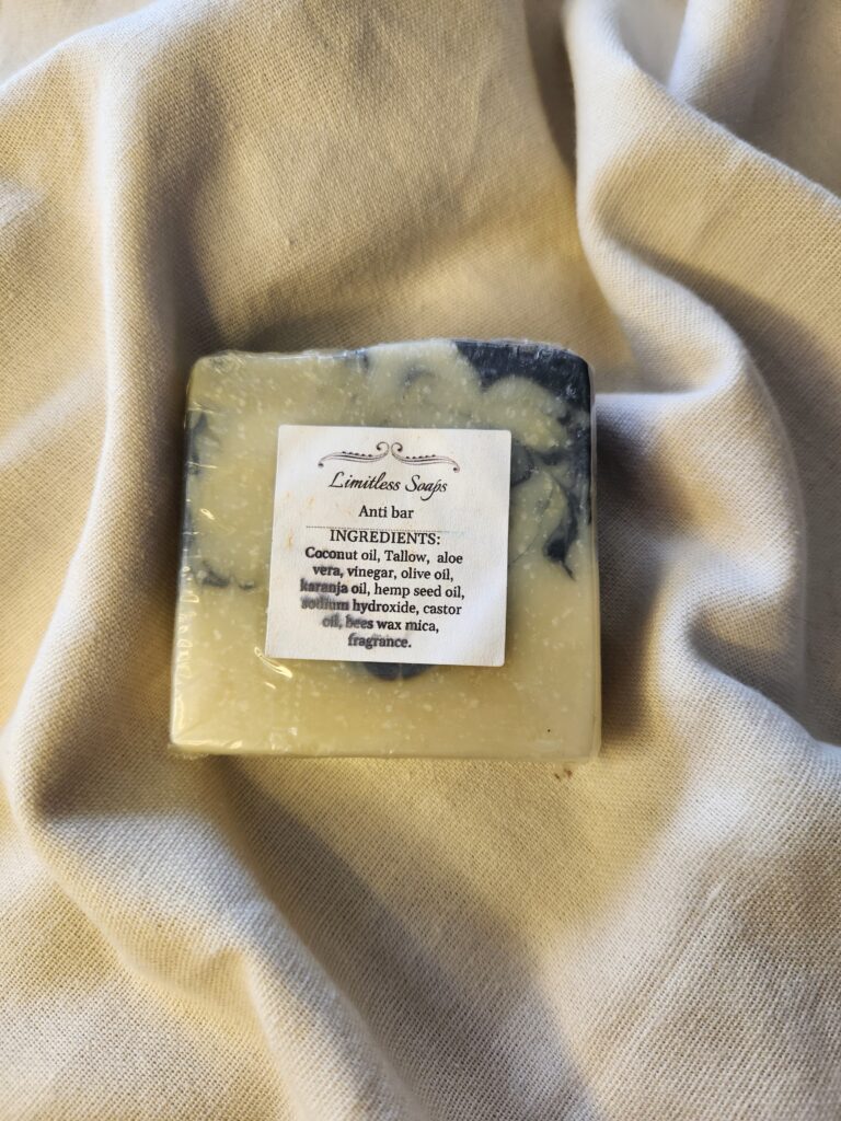 soap bar with swirls of black and pale yellow with product label