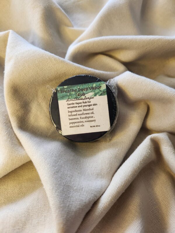 0.9 ounce salve container with product label