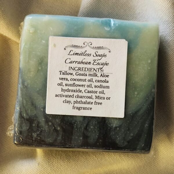 soap bar with splashes of black, greens, and blues, and the product label