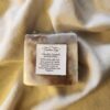 soap bar with swirls of brown and purple with product label