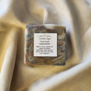soap bar with swirls of deep red, brown, and black with product label