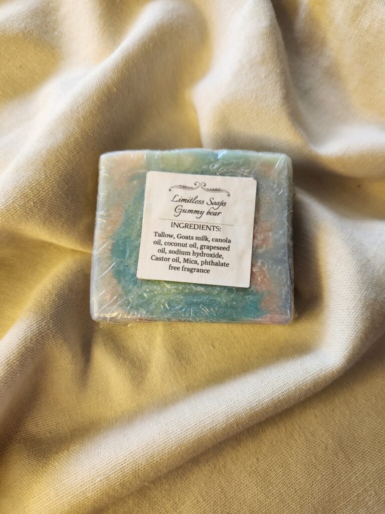 soap bar with swirls of green, blue, pink, and purple with product label