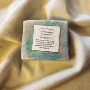 soap bar with swirls of green, blue, pink, and purple with product label