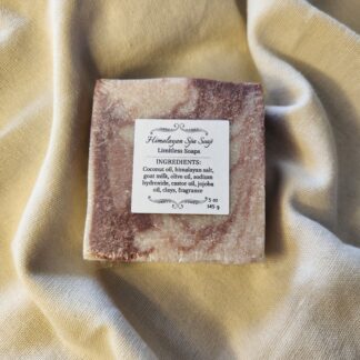soap bar with swirls of deep red with product label