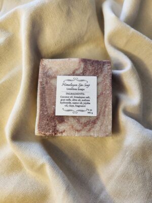 soap bar with swirls of deep red with product label
