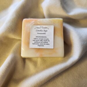 soap bar with swirls of orange and yellow with product label