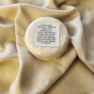 white shampoo bar with product label