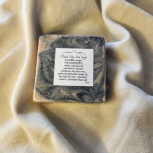 soap bar with swirls of black with product label