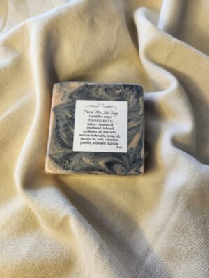 soap bar with swirls of black with product label