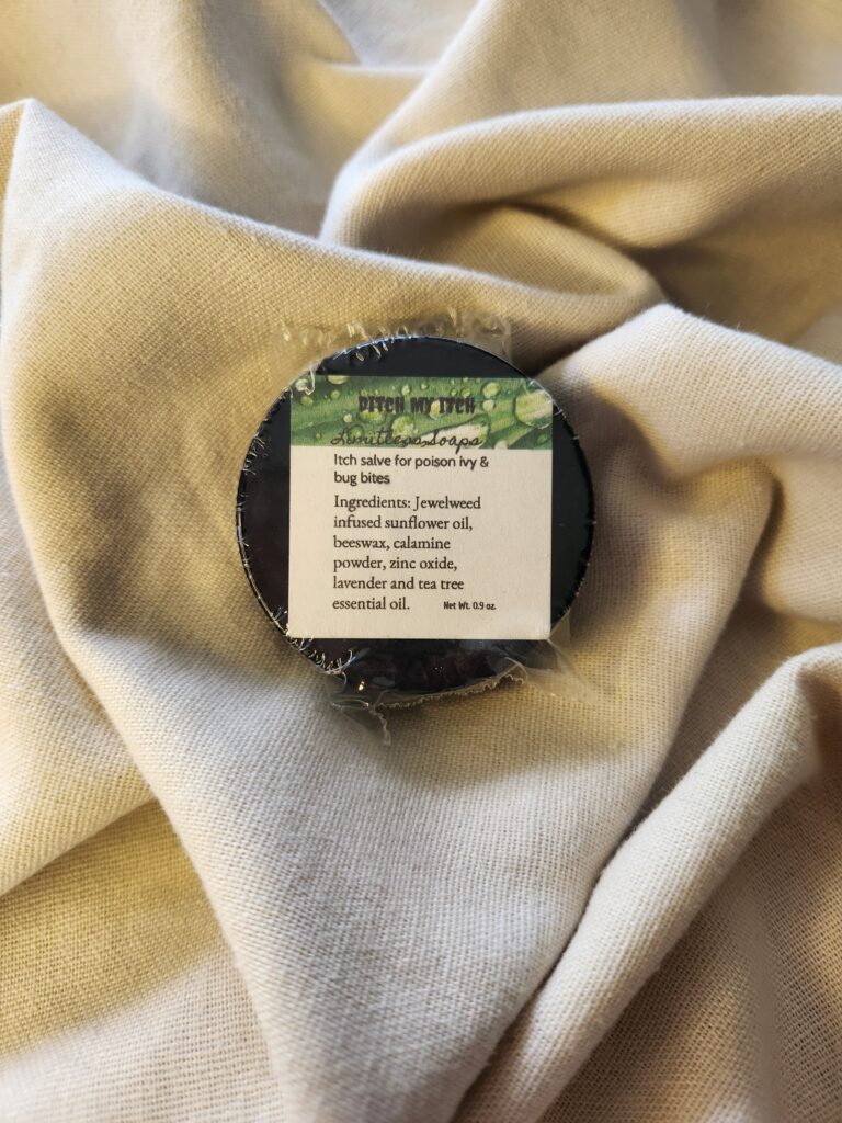 0.9 ounce salve container with product label