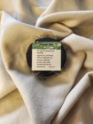 0.9 ounce salve container with product label