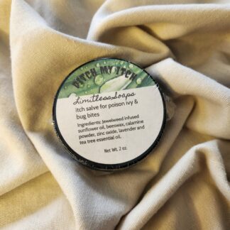 2 ounce salve container with product label