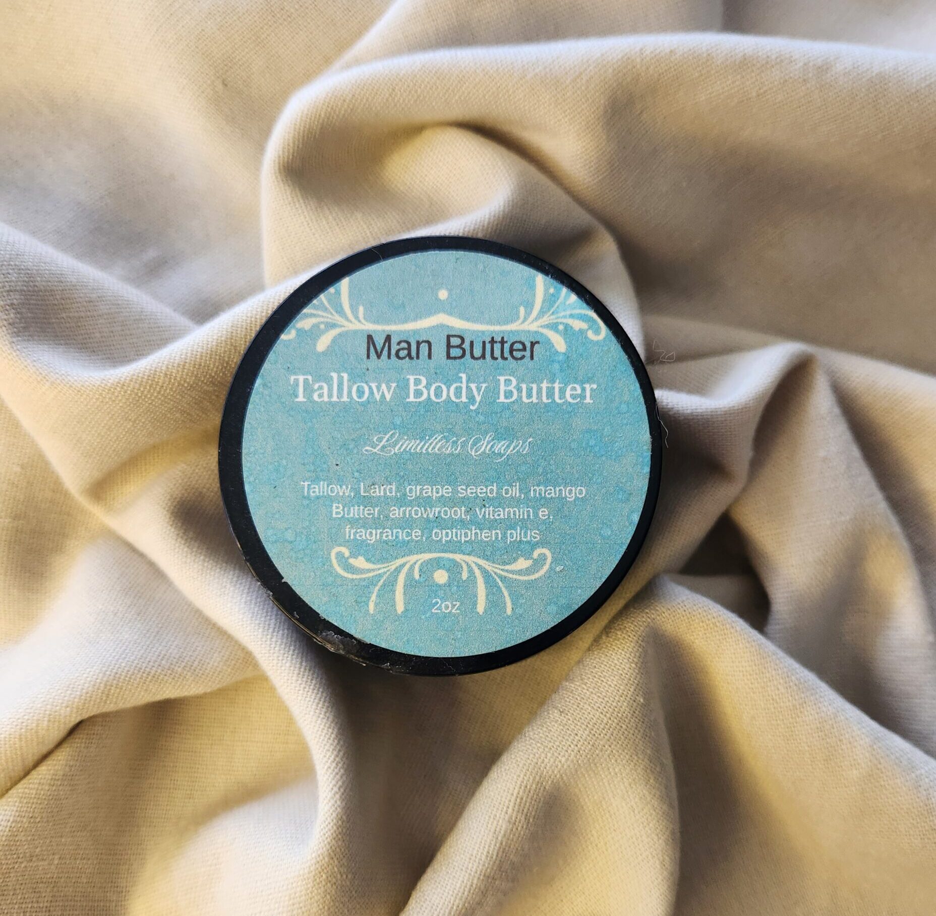 2 ounce salve container with product label