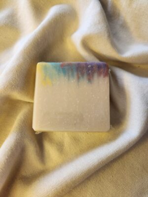 soap bar with splashes of red, purple, blue, and yellow