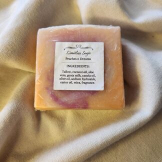 soap bar with swirls of orange and pink with product label