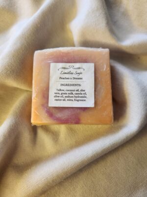 soap bar with swirls of orange and pink with product label