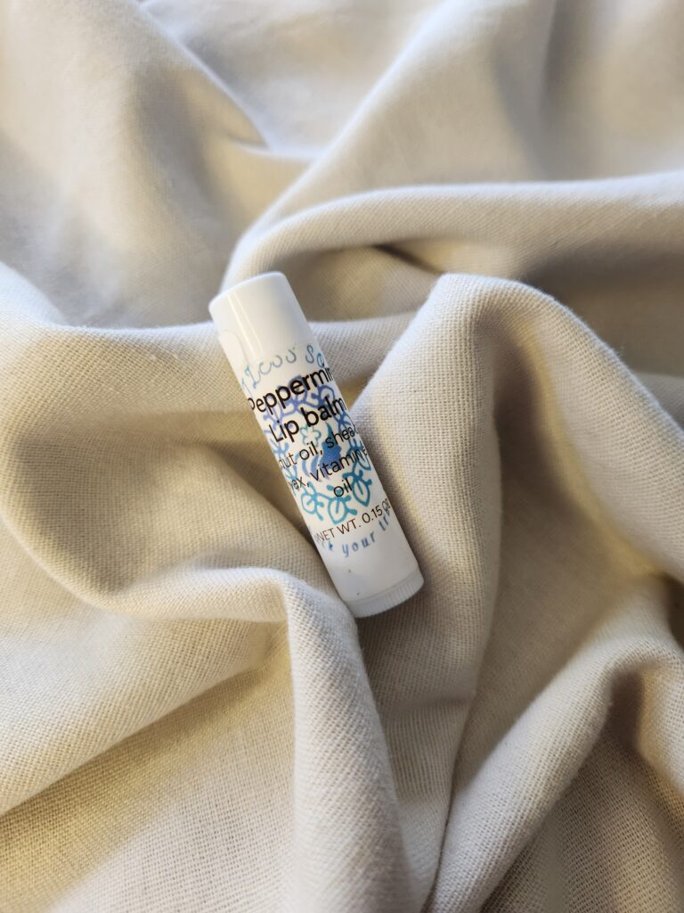 lip balm container with product label