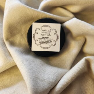 0.9 ounce salve container with product label