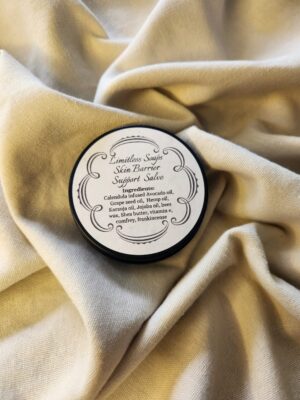 2 ounce salve container with product label