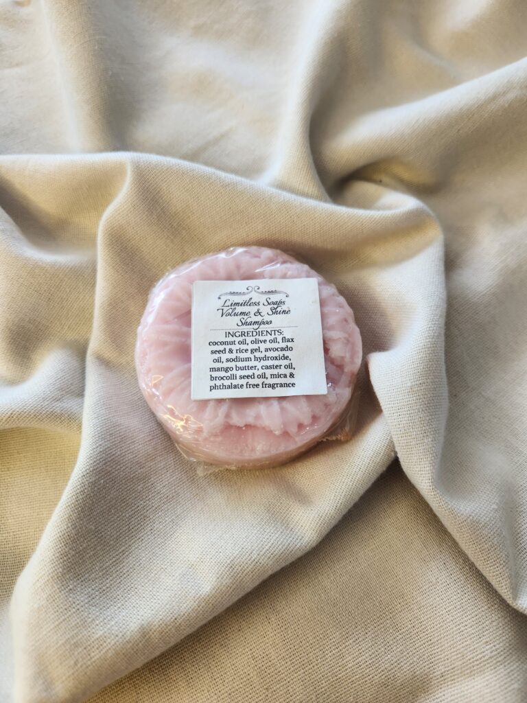 pink shampoo bar with a flower design with product label