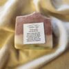 Watermelon1 soap bar with red, white, and green stripes with product label