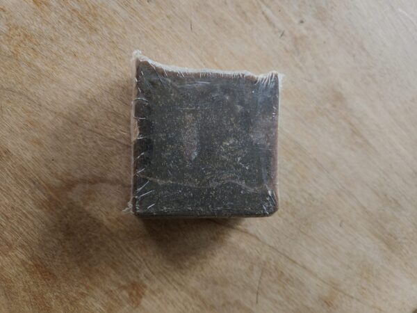 Gingerbread black soap bar with flecks of brown