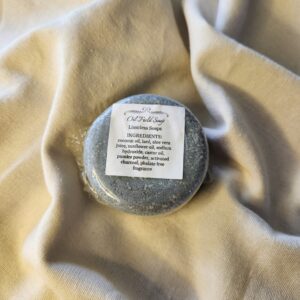 Dark gray soap bar with product label