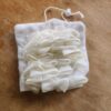luffa2 white soap saver luffa in open position scrub side out